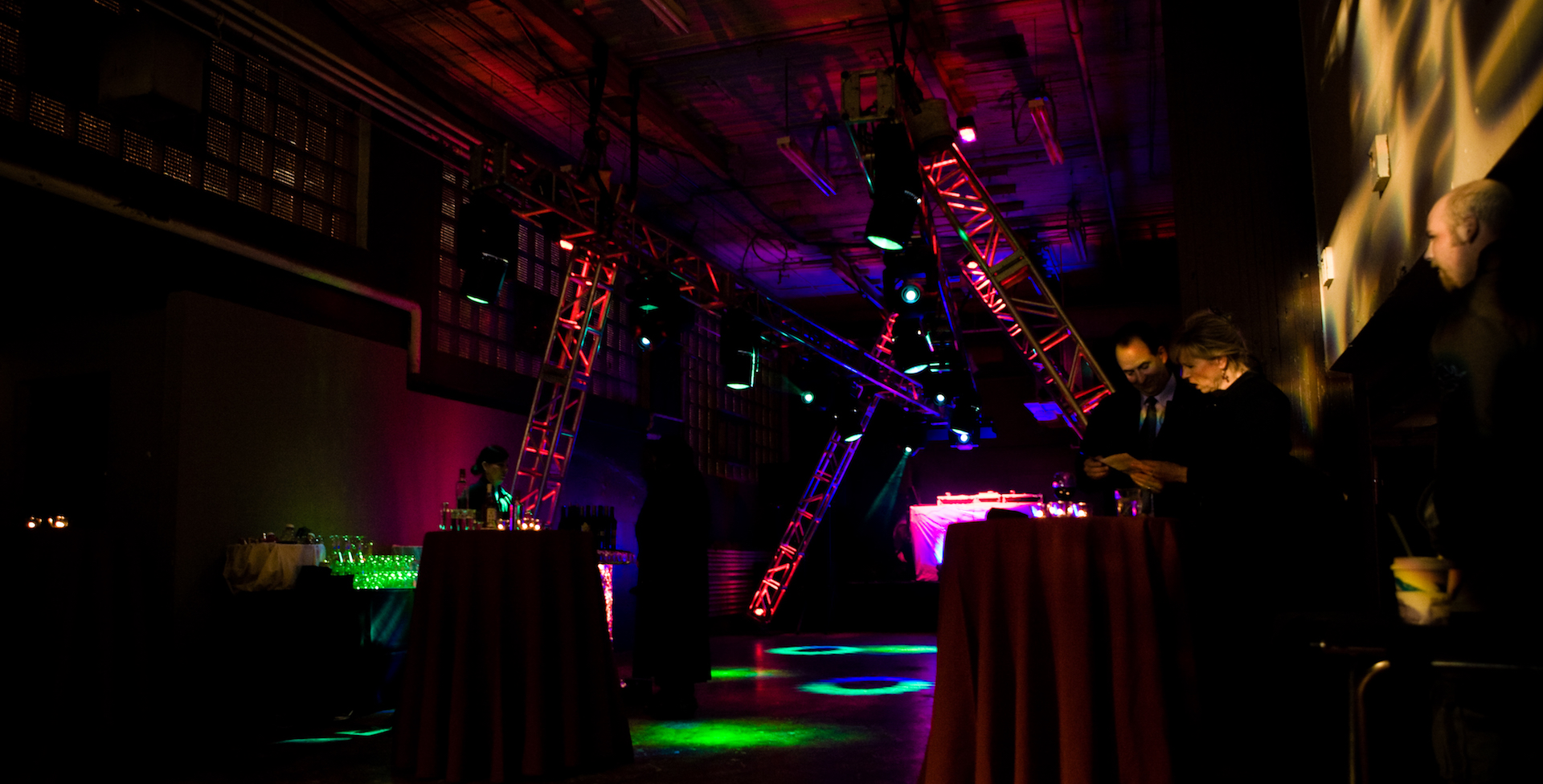Truss sticks at odd angles and breakup gobos create a mysterious and exciting atmposphere for a corporate party