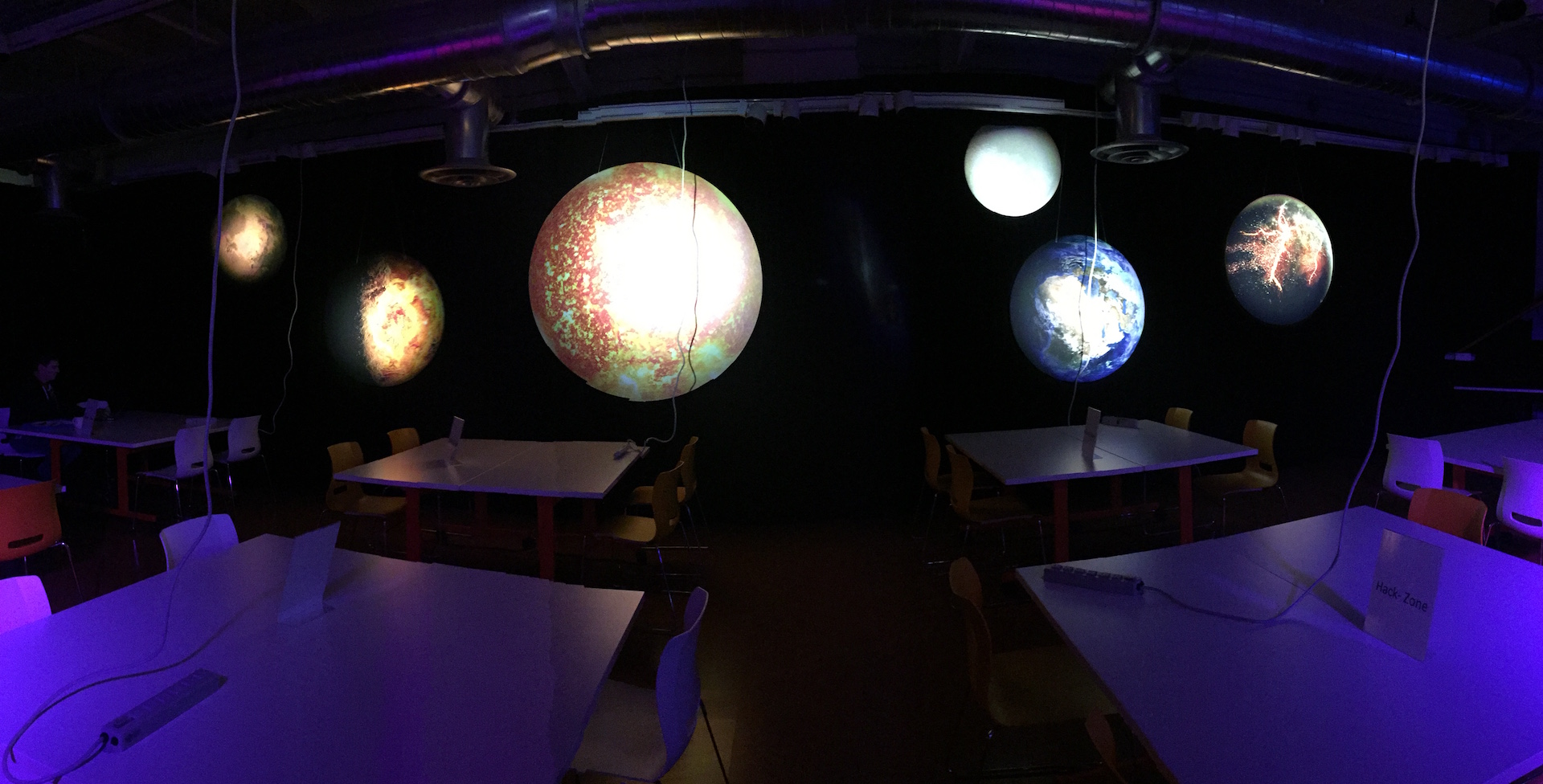 Thick, quality custom signs create a planetary solar system for a space themed hackathon